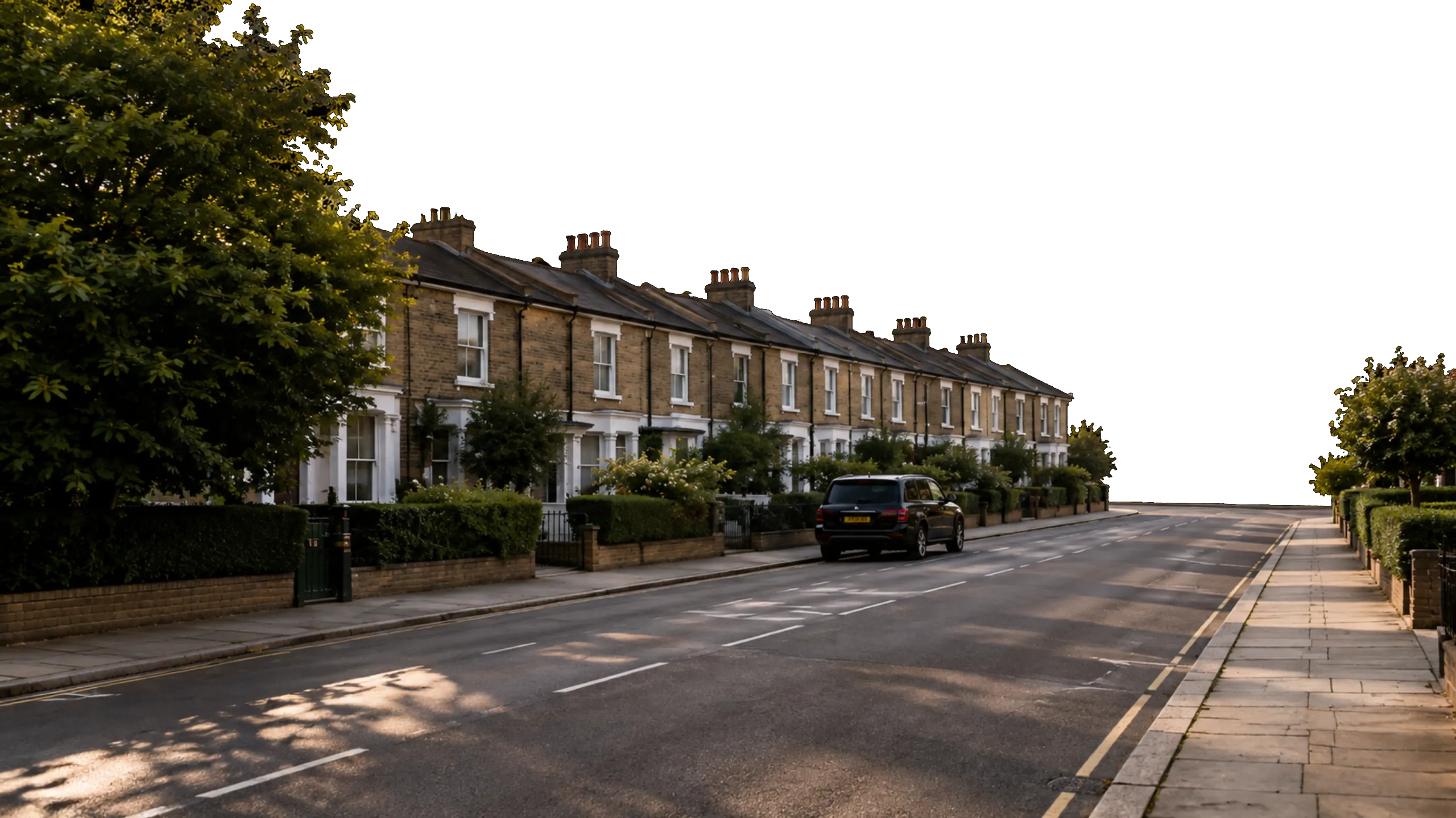 A London terraced street at golden hour with the City skyline behind it